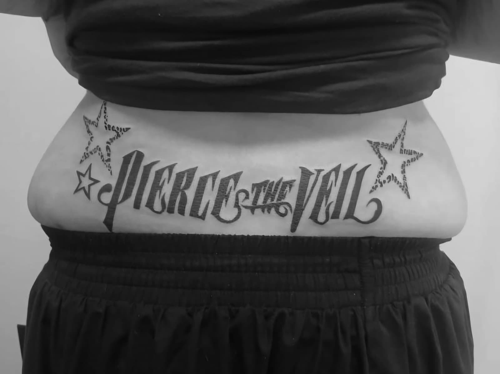 “Pierce the Veil” lettering between two stars across the lower back